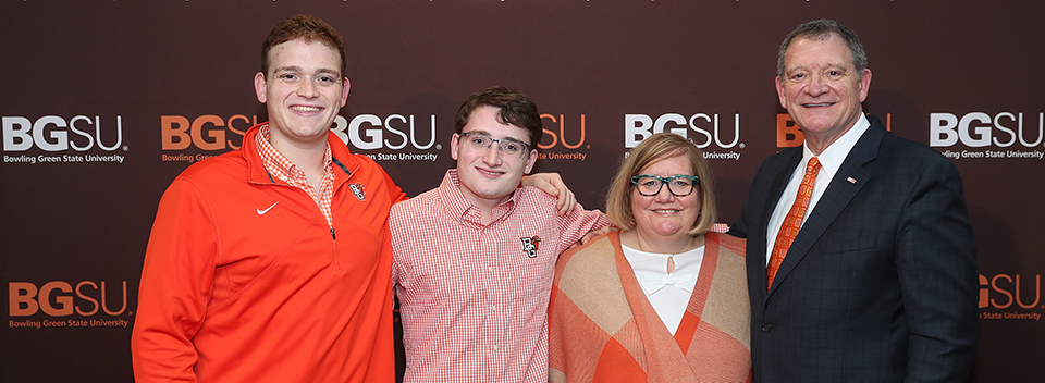 President Rogers with wife, Dr. Sandra Earle, and their two sons, Isaac and Spencer