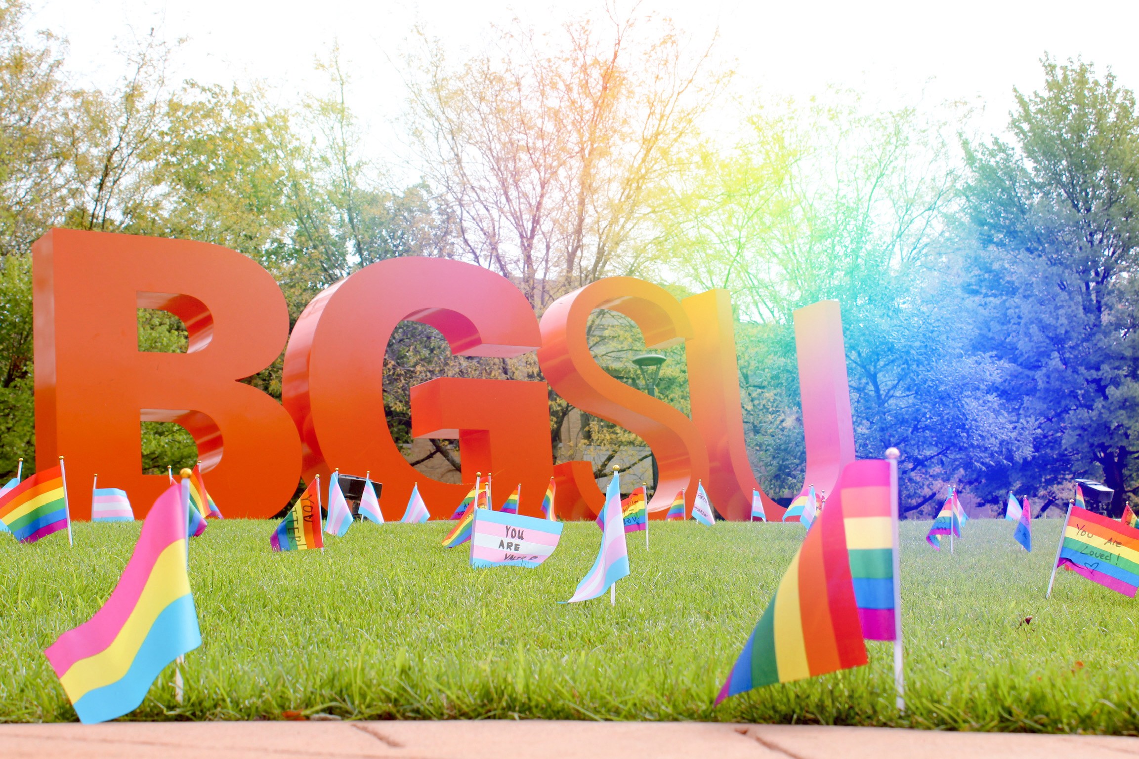 Flags in the lawn in front of BGSU letters in Union Oval